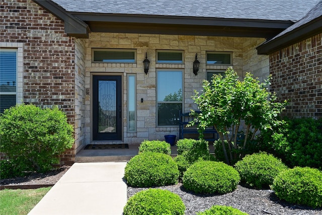 8301 Cimarron Trl, Abilene, TX 79606 - entrance to property featuring stone siding and roof with shingles