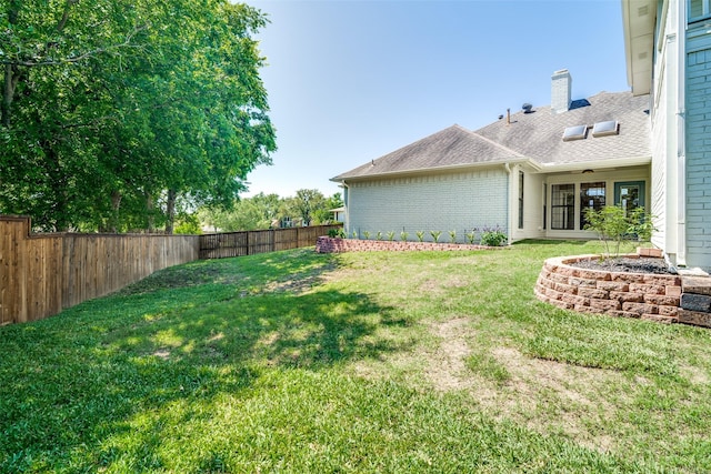 view of yard featuring a fenced backyard