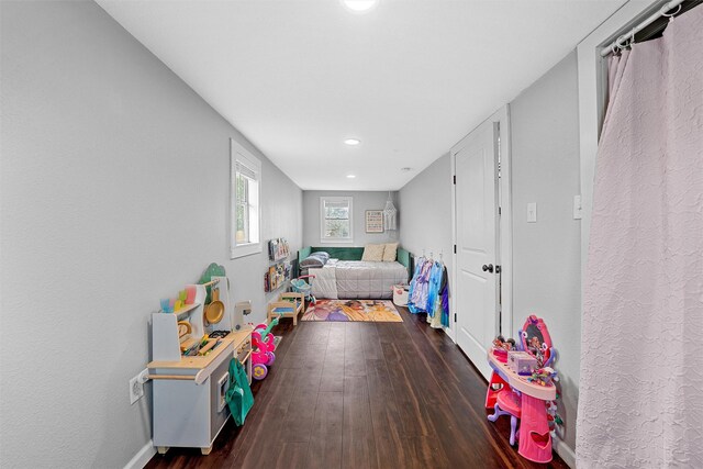 rec room featuring baseboards, recessed lighting, and dark wood-type flooring