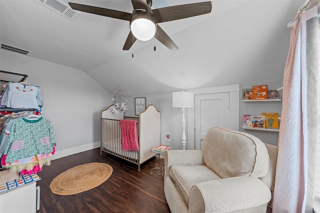 living area with vaulted ceiling, wood finished floors, visible vents, and ceiling fan