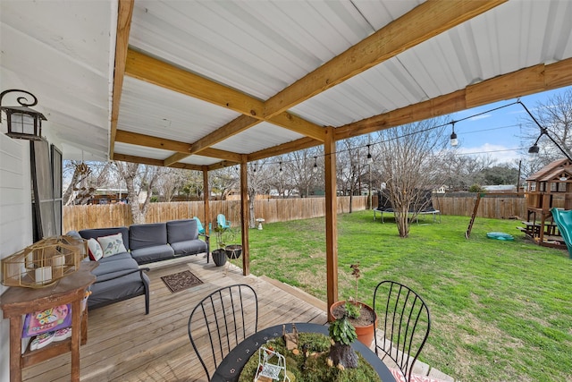 view of patio featuring a deck, a trampoline, a fenced backyard, a playground, and outdoor lounge area