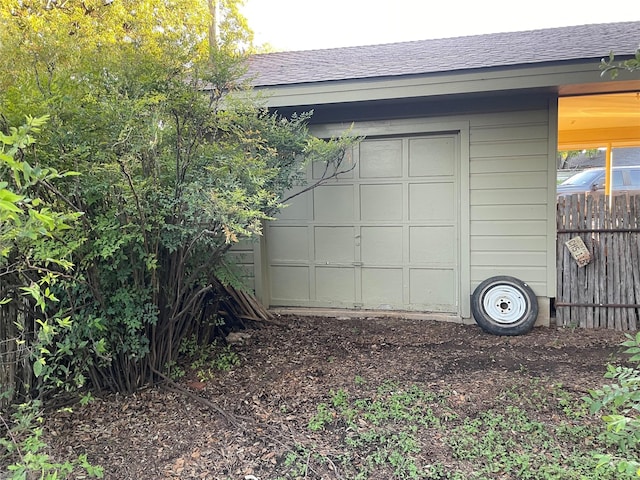 garage with fence