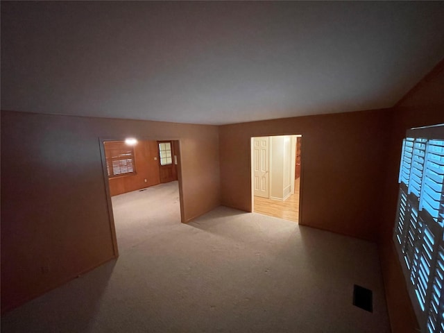 empty room featuring light carpet