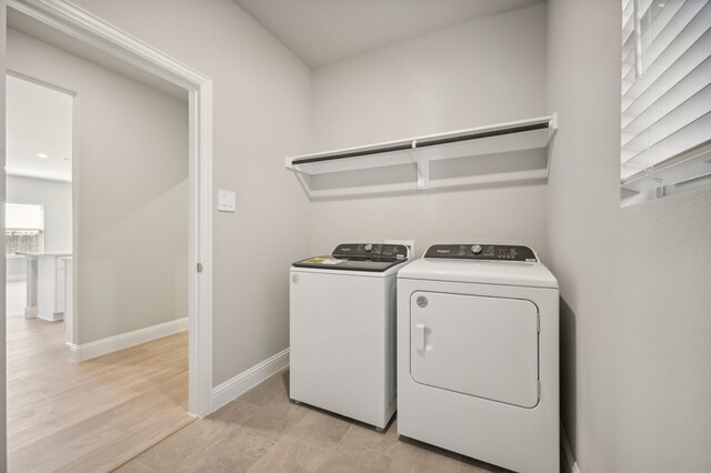 604 Willet Dr, Mckinney, TX 75069 - clothes washing area with washer and clothes dryer and baseboards