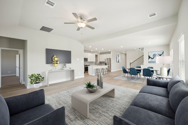 604 Willet Dr, Mckinney, TX 75069 - living area with stairs, light wood-style flooring, ceiling fan, baseboards, and recessed lighting