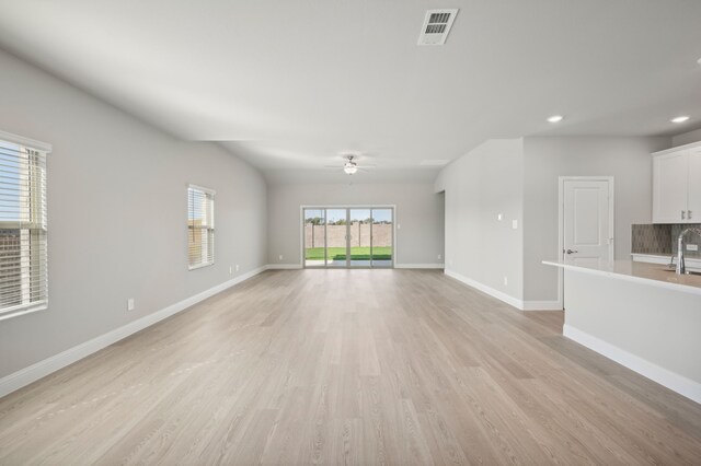 604 Willet Dr, Mckinney, TX 75069 - unfurnished living room featuring recessed lighting, baseboards, light wood finished floors, ceiling fan, and visible vents