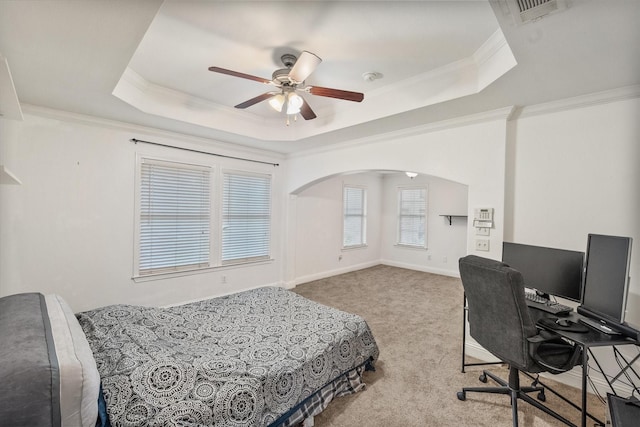 13336 Patito Pl Unit 7, Dallas, TX 75240 - carpeted bedroom with a ceiling fan, a tray ceiling, crown molding, visible vents, and arched walkways