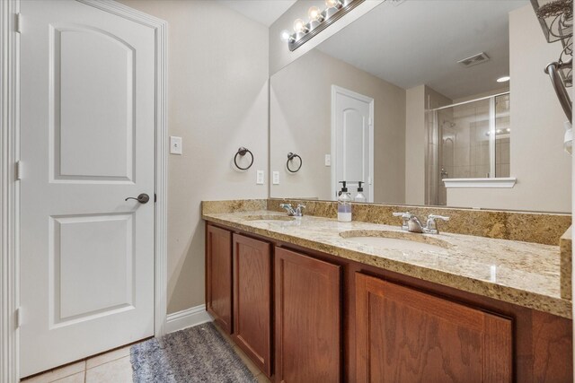 13336 Patito Pl Unit 7, Dallas, TX 75240 - bathroom featuring a shower stall, tile patterned floors, visible vents, and a sink