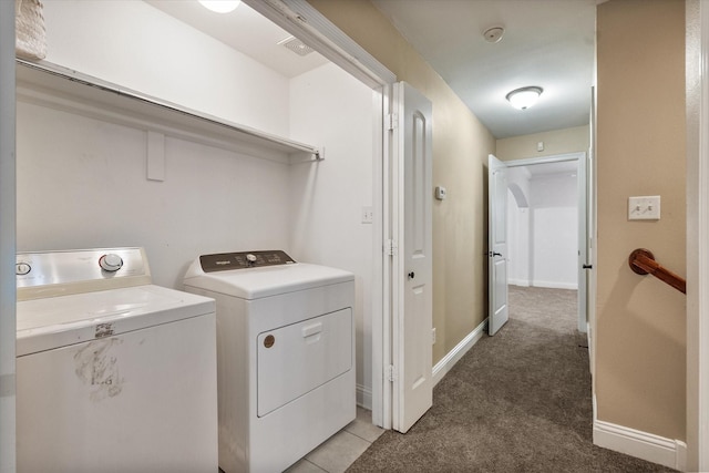 13336 Patito Pl Unit 7, Dallas, TX 75240 - laundry area featuring washing machine and clothes dryer, baseboards, laundry area, and light colored carpet
