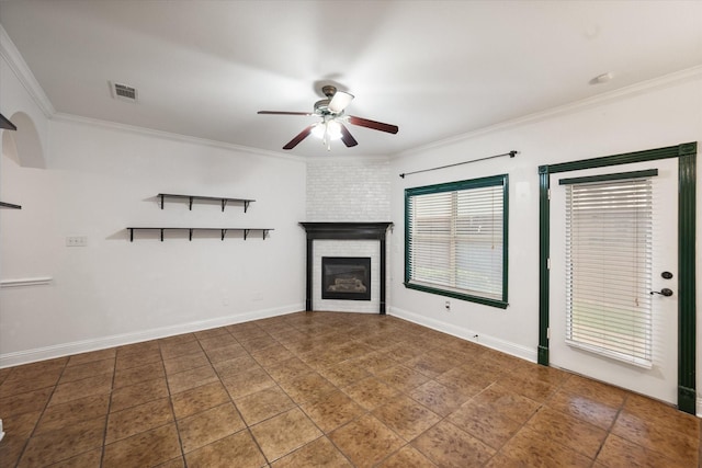 13336 Patito Pl Unit 7, Dallas, TX 75240 - unfurnished living room featuring baseboards, ceiling fan, visible vents, a brick fireplace, and crown molding