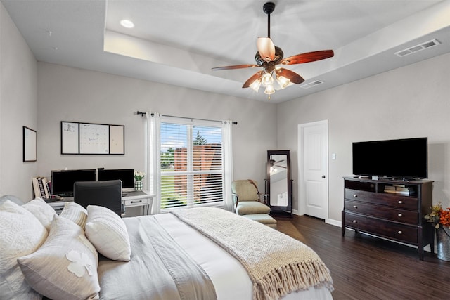 6093 S Fm 730, Decatur, TX 76234 - bedroom featuring dark wood finished floors, a tray ceiling, baseboards, and a ceiling fan