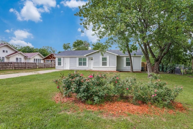 single story home with fence and a front yard