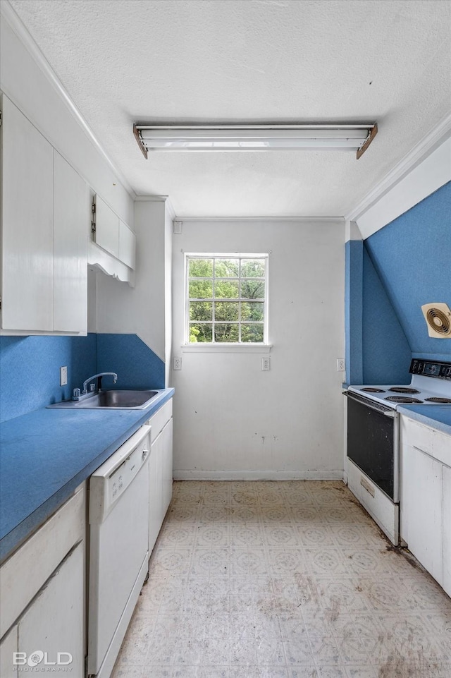 kitchen featuring light floors, white appliances, a sink, crown molding, and white cabinets