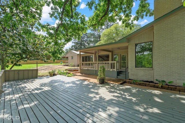 wooden deck featuring fence
