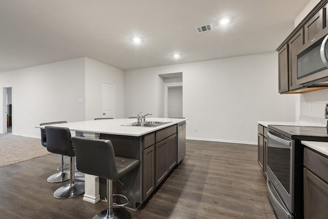 kitchen featuring light countertops, visible vents, appliances with stainless steel finishes, and a sink