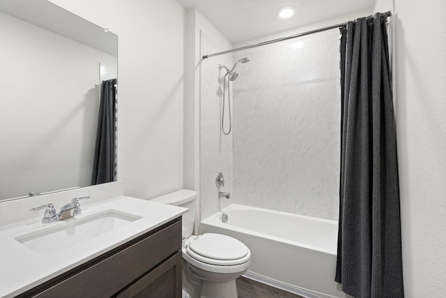 full bathroom with toilet, vanity, shower / bath combo with shower curtain, and wood finished floors