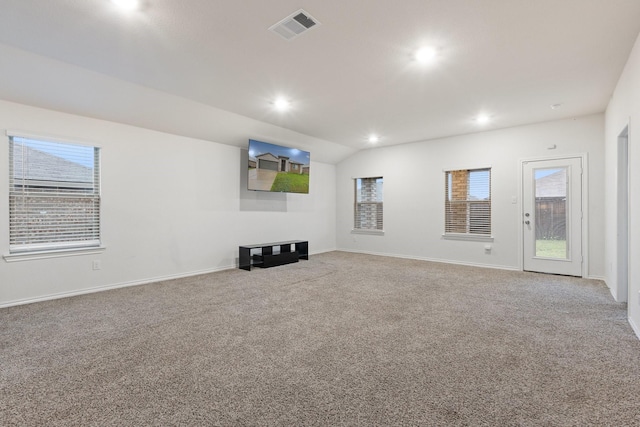 unfurnished living room with lofted ceiling, carpet, visible vents, recessed lighting, and baseboards