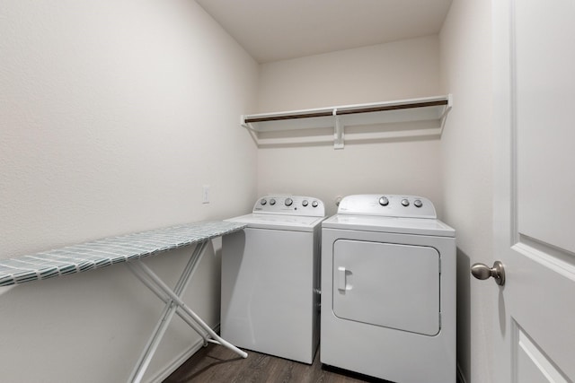 washroom featuring laundry area, dark wood-style flooring, and independent washer and dryer