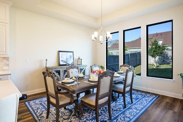 915 Blueberry Way, Northlake, TX 76247 - dining space featuring a tray ceiling, a chandelier, baseboards, and dark wood-style floors