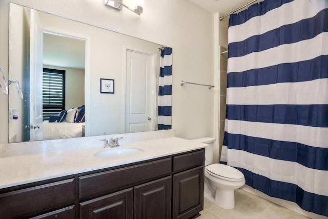 915 Blueberry Way, Northlake, TX 76247 - ensuite bathroom with a shower with curtain, toilet, ensuite bath, tile patterned floors, and vanity