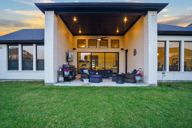 915 Blueberry Way, Northlake, TX 76247 - back of property featuring a yard, a patio area, outdoor lounge area, and brick siding