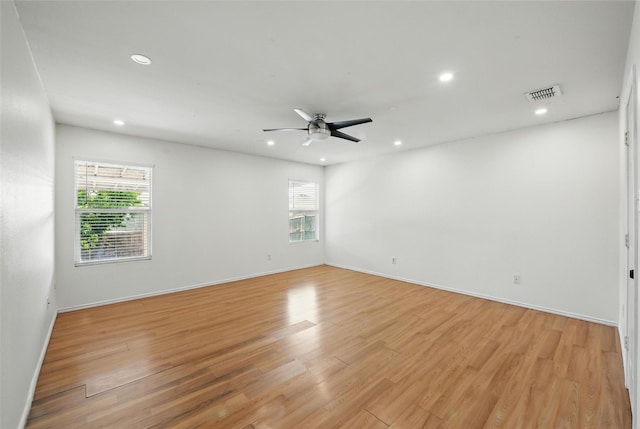 3105 Lipizzan Dr, Denton, TX 76210 - empty room featuring recessed lighting, plenty of natural light, a ceiling fan, light wood-style flooring, and baseboards
