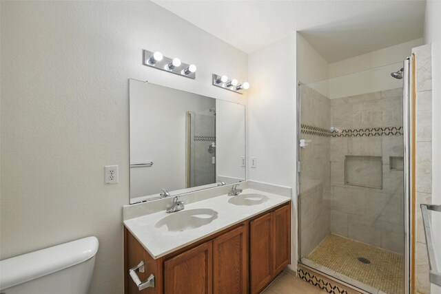 3105 Lipizzan Dr, Denton, TX 76210 - bathroom with toilet, double vanity, and tiled shower