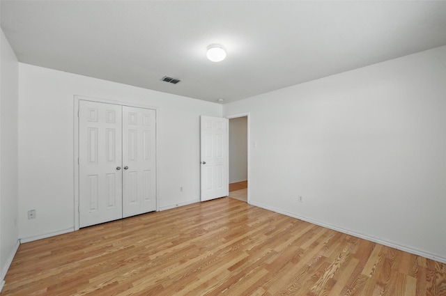 3105 Lipizzan Dr, Denton, TX 76210 - unfurnished bedroom featuring light wood-type flooring, baseboards, and a closet