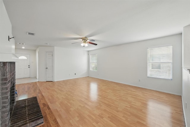 3105 Lipizzan Dr, Denton, TX 76210 - unfurnished living room featuring ceiling fan, light wood-style floors, and baseboards