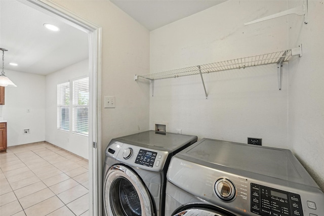 3105 Lipizzan Dr, Denton, TX 76210 - washroom with washer and clothes dryer and light tile patterned floors