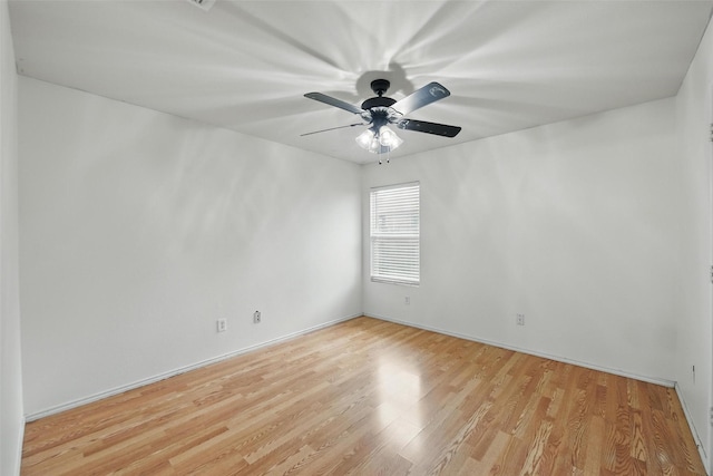 3105 Lipizzan Dr, Denton, TX 76210 - unfurnished room with light wood-style flooring, a ceiling fan, and baseboards