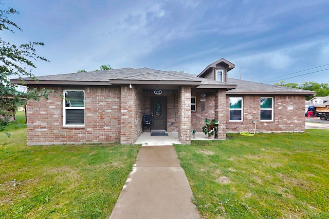 600 Saint Luke St, Terrell, TX 75160 - view of front facade with a front lawn and brick siding