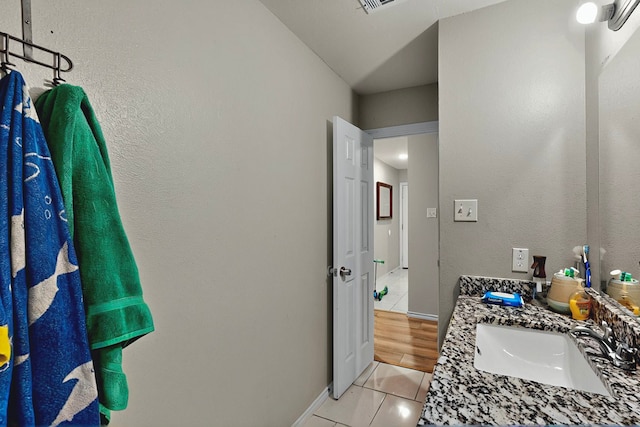 600 Saint Luke St, Terrell, TX 75160 - bathroom featuring vanity, baseboards, and tile patterned floors