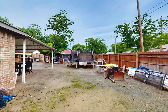600 Saint Luke St, Terrell, TX 75160 - view of patio with fence and a trampoline
