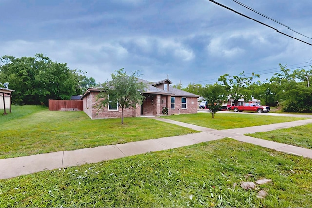 600 Saint Luke St, Terrell, TX 75160 - view of front of home featuring brick siding and a front lawn