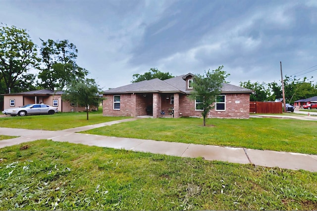 600 Saint Luke St, Terrell, TX 75160 - ranch-style house featuring brick siding, a front lawn, and fence