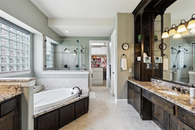500 Denton Creek Dr, Mckinney, TX 75072 - full bathroom with a shower stall, a walk in closet, vanity, and tile patterned flooring