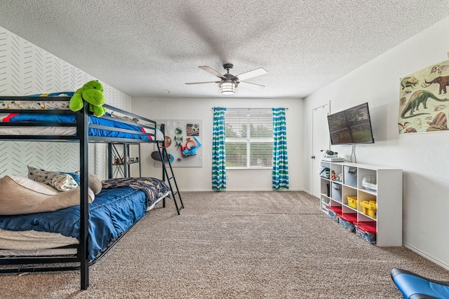 bedroom with baseboards, carpet flooring, ceiling fan, and a textured ceiling