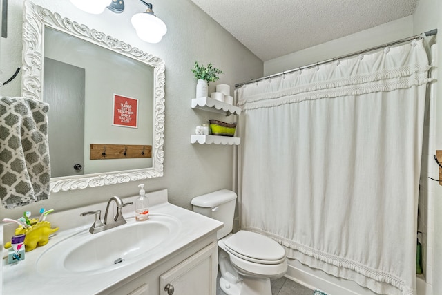 bathroom featuring toilet, vanity, a textured ceiling, and shower / bath combo