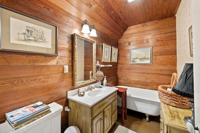 bathroom with wooden walls, a freestanding tub, and wood ceiling