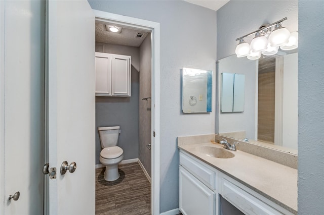 2105 Warnford Pl, Arlington, TX 76015 - bathroom with toilet, visible vents, baseboards, and vanity