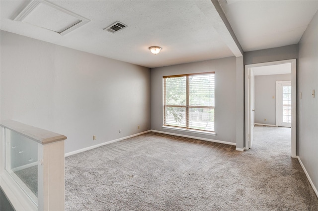 2105 Warnford Pl, Arlington, TX 76015 - carpeted spare room featuring attic access, baseboards, and visible vents