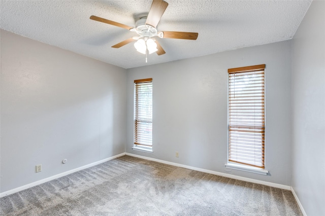2105 Warnford Pl, Arlington, TX 76015 - carpeted empty room featuring baseboards, ceiling fan, and a textured ceiling