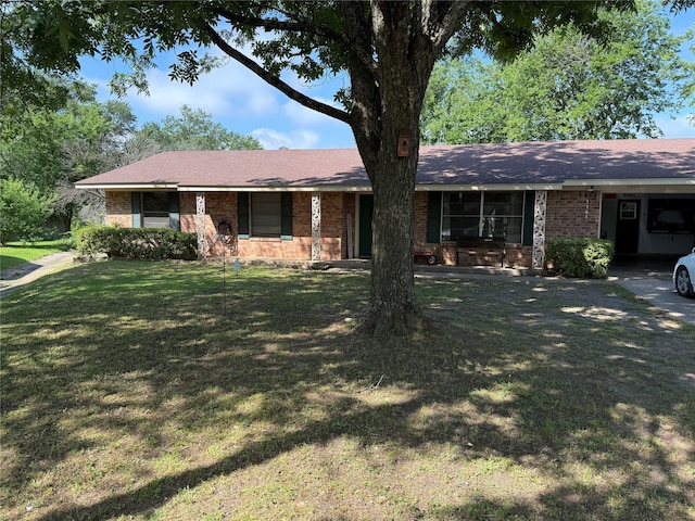 1141 Bowie St, Sulphur Springs, TX 75482 - ranch-style home with brick siding, a front lawn, and an attached carport