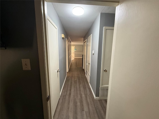 1141 Bowie St, Sulphur Springs, TX 75482 - hall featuring wood finished floors and baseboards