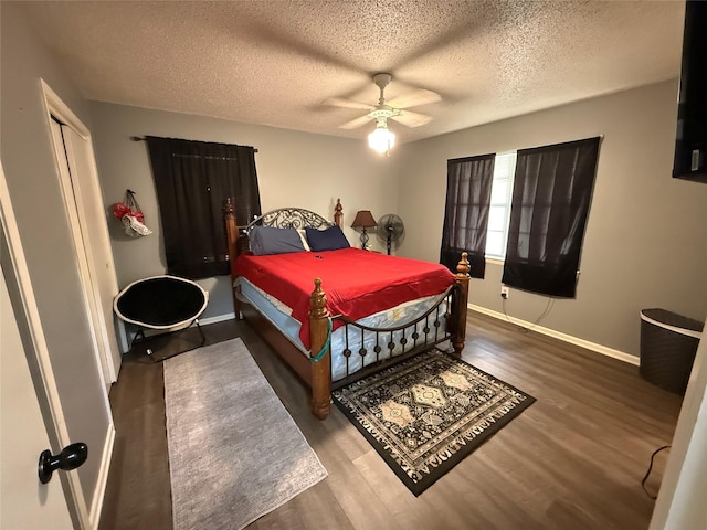 1141 Bowie St, Sulphur Springs, TX 75482 - bedroom with baseboards, a textured ceiling, wood finished floors, and a ceiling fan