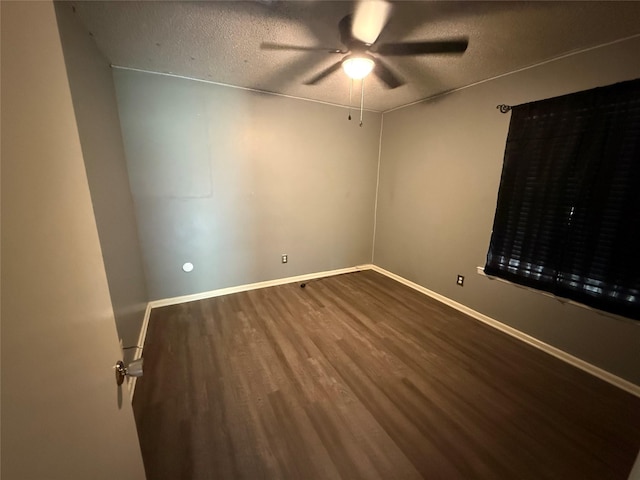 1141 Bowie St, Sulphur Springs, TX 75482 - spare room featuring ceiling fan, wood finished floors, a textured ceiling, and baseboards