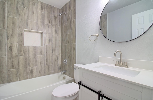 full bath with shower / bath combination, vanity, toilet, and a textured wall