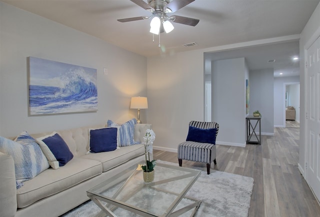 living area featuring wood finished floors, visible vents, recessed lighting, a ceiling fan, and baseboards