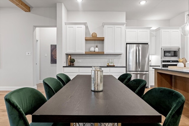 913 Beall St, Denton, TX 76207 - dining space featuring light wood-style flooring, baseboards, and recessed lighting